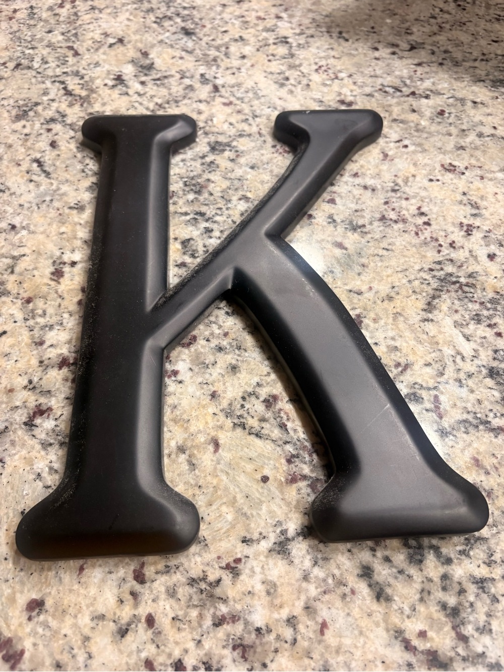 Black “K” wood wall decor piece *Paint needs touched up*